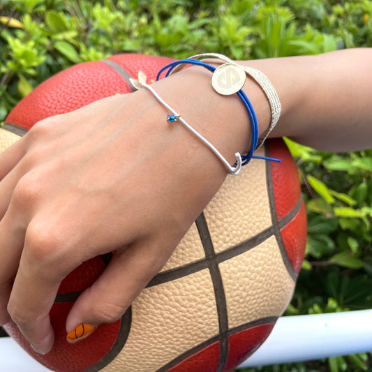 Rubber bracelet set with emblem charm