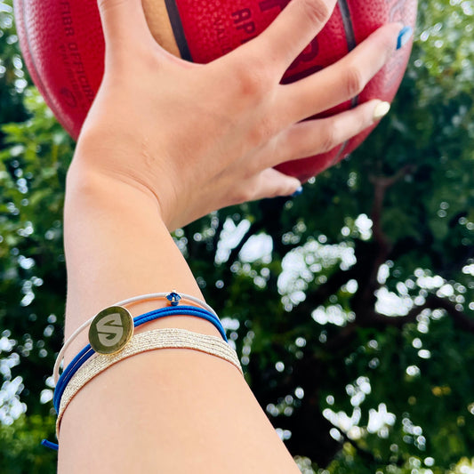 Rubber bracelet set with emblem charm